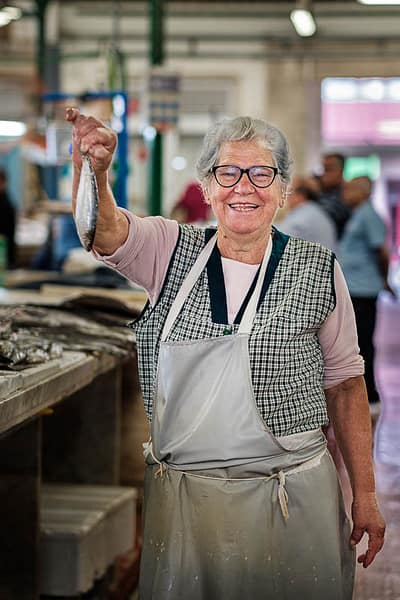 Fish seller at Almada market