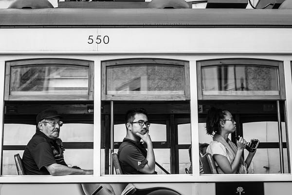 Lisbon tram passengers looking out the window